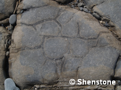Ancient, fossilised mud cracks. these form in the same way as the ones seen in modern dried out muddy areas